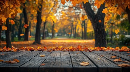 Autumn leaves scattered on wooden table with a blurry park pathway in the background, golden sunlight filtering through trees, serene outdoor setting