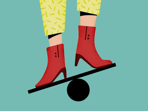 Faceless woman balancing on ball