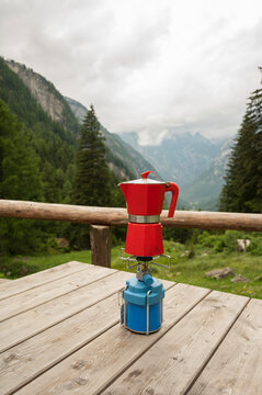 Red Coffee Pot on a Portable Stove in the Mountains