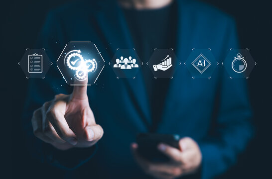 Automation and Workflow Optimization Concept. Businessman with icons automation, workflow optimization, and artificial intelligence. importance of efficient business processes using modern technology.