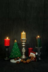 Christmas still life with candles that are lit in a Portrait Orientation