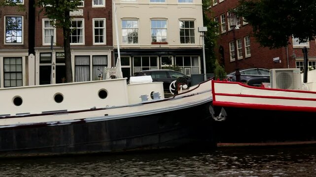 Footage clip of a quiet canal cruise in the beautiful city of Amsterdam