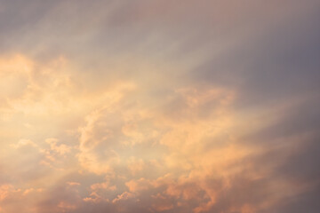 clouds at sunset illuminated by the sun's rays