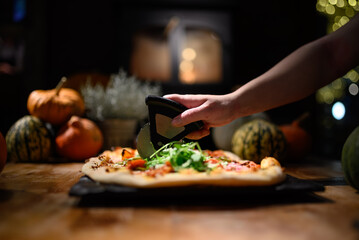 Pizza Cutter in Action on a Fresh Sourdough Pizza: Authentic, Handcrafted Pizza Sliced for Sharing