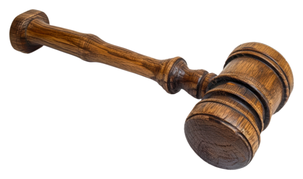 Elegant wooden gavel lying on a surface in a courtroom setting isolated on transparent background