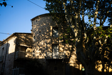 old village stone building tree shadow P&eacute;zenas