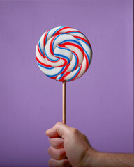 Colorful lolly pop isolated on a purple background.