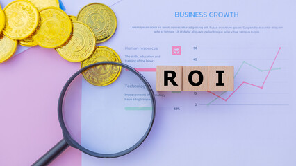 Wooden cube with the word ROI. It is an abbreviation of Return on Investment. Business profitability success growth profitability analytics. Business and financial market concept.