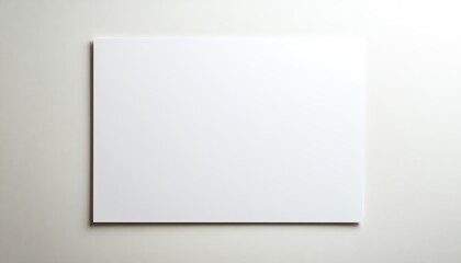 Fototapeta premium Blank White Canvas Hanging on a White Wall