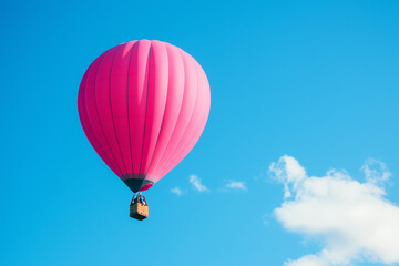 Fototapeta premium Soaring Magenta Balloon on a Skyward Route: A Vibrant Journey