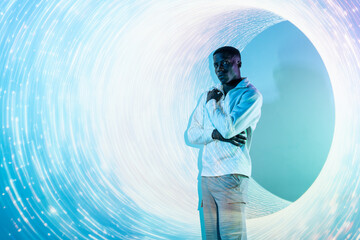 Futuristic portrait of black man against circular light design