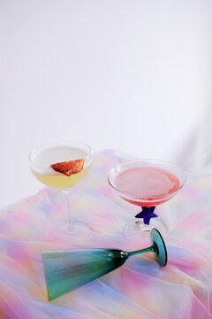 2 coctails and empty glass
