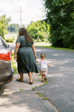 family going to car to leave together