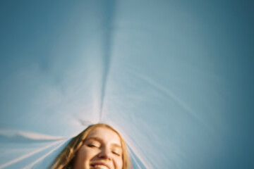 Smiling woman under blue sky - Carefree