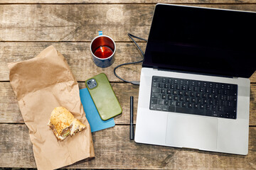 Freelancer's essentials on a picnic table