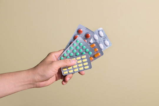 Hand holding blisters pills capsules medicine pharmacy