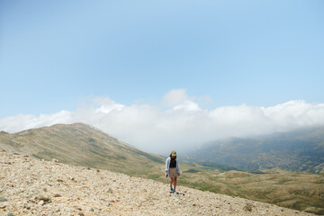 Woman Walking On Mountain Trail In Deserted Area
