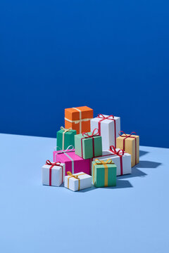 Top view of different gift boxes on blue background.