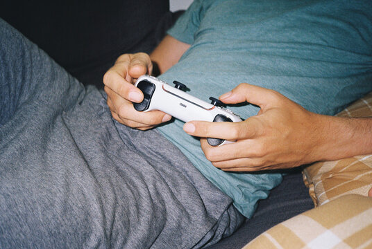 Man playing video games with a joystick