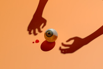 Halloween eye and hand shadows