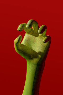 Green hand reaching up. Halloween concept