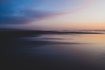 Dramatic sky over vast beach and coast