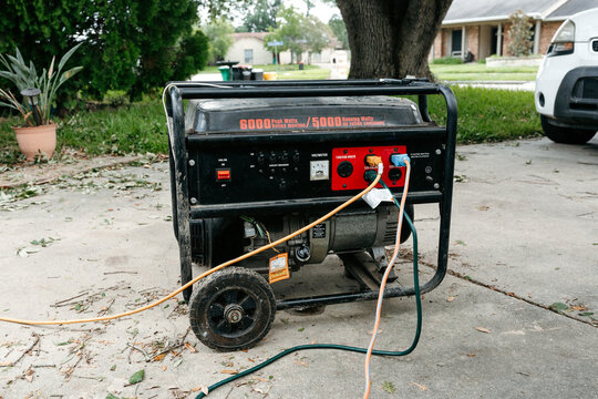 Black Generator in Driveway During Hurricane