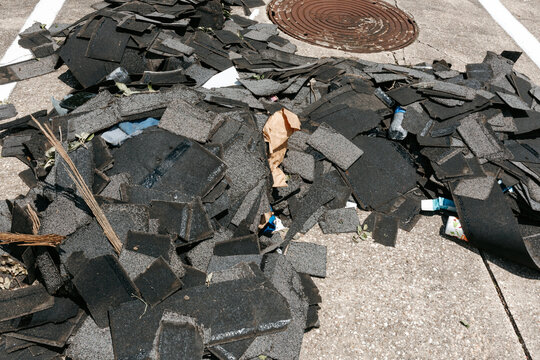 Stacked Roof Shingles After Hurricane Winds