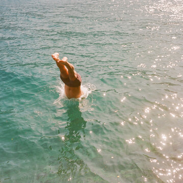 Man diving into lake 