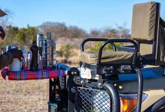 Fototapeta Morning coffee being made on the front of a safari truck. 