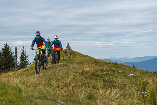 Two riders in Austrian Alps.