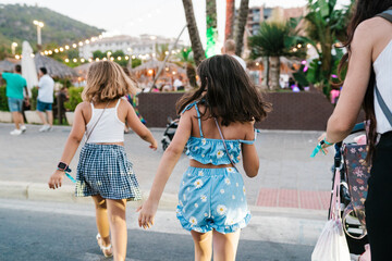 Girls Exploring Evening Market