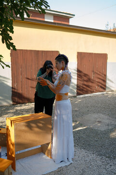A woman is modeling fo her mother