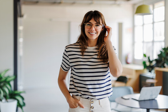Designer woman smiling in her office