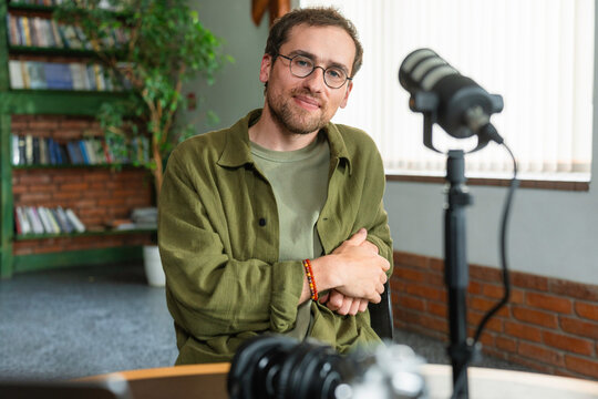 A man records a podcast