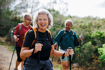 Senior women hiking in nature enjoying their retirement