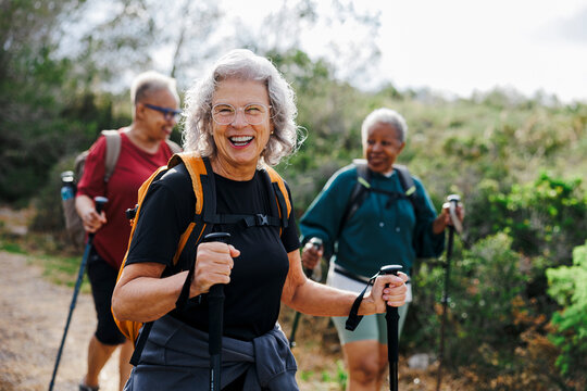 Senior women hiking in nature enjoying their retirement