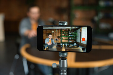 A man records a video blog