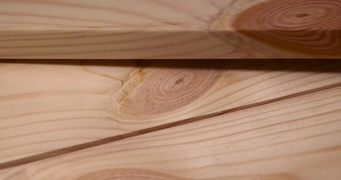 pine edged board with a lot of knots, low-quality untreated board close-up