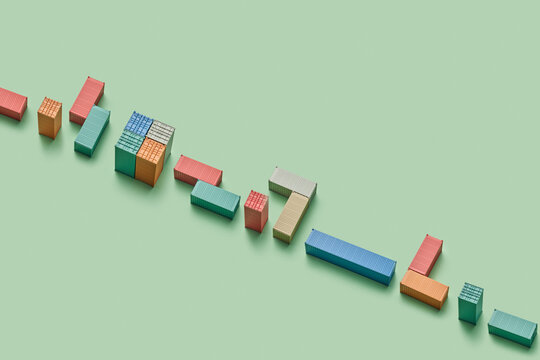 Variety of cargo containers placed in chaotic order in studio