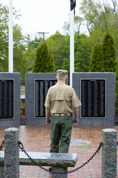 Senior Citizen military man Veteran Portrait  war memorial from behind
