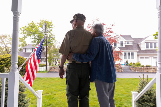 Senior Citizen  Veteran Portrait at home with American flag 