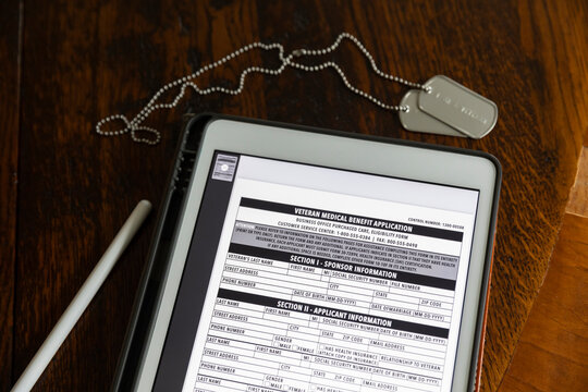 Veteran Medical benefits form on computer tablet stylus 