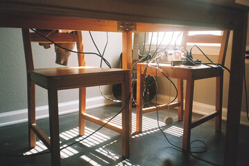 Chairs and wires under table