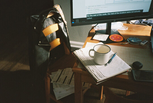 Messy home office desk 