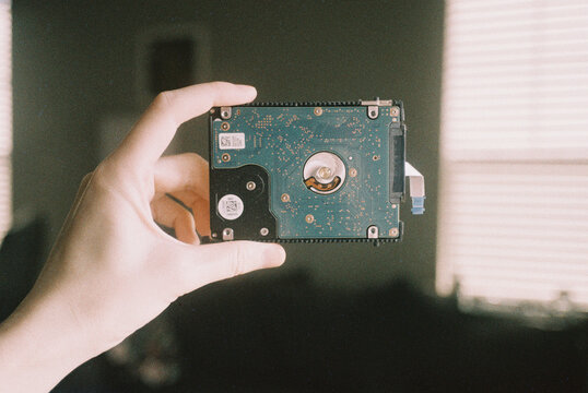 Hand is holding hard drive