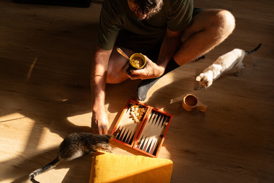 Man Eating Noodles Relaxed on Floor
