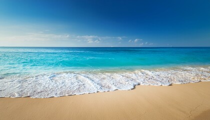 Fototapeta premium Soft blue ocean wave on clean sandy beach, landscape background