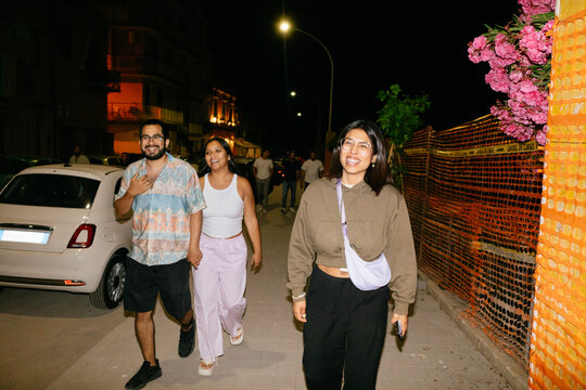 Friends Strolling At Night