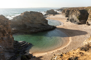 Landscape of a beach with turquoise waters in the shape of a heart